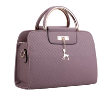 Load image into Gallery viewer, PURSE WITH ANIMAL BUCKLE DESIGN