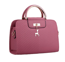 Load image into Gallery viewer, PURSE WITH ANIMAL BUCKLE DESIGN