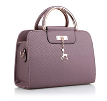 Load image into Gallery viewer, PURSE WITH ANIMAL BUCKLE DESIGN