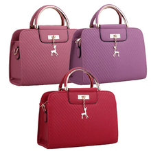 Load image into Gallery viewer, PURSE WITH ANIMAL BUCKLE DESIGN
