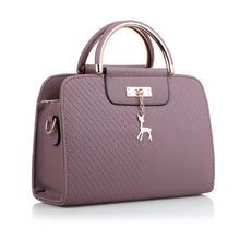 Load image into Gallery viewer, PURSE WITH ANIMAL BUCKLE DESIGN
