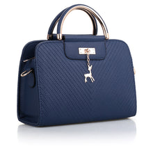 Load image into Gallery viewer, PURSE WITH ANIMAL BUCKLE DESIGN
