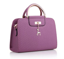 Load image into Gallery viewer, PURSE WITH ANIMAL BUCKLE DESIGN
