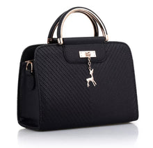Load image into Gallery viewer, PURSE WITH ANIMAL BUCKLE DESIGN
