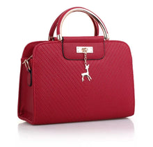 Load image into Gallery viewer, PURSE WITH ANIMAL BUCKLE DESIGN
