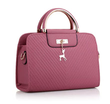 Load image into Gallery viewer, PURSE WITH ANIMAL BUCKLE DESIGN
