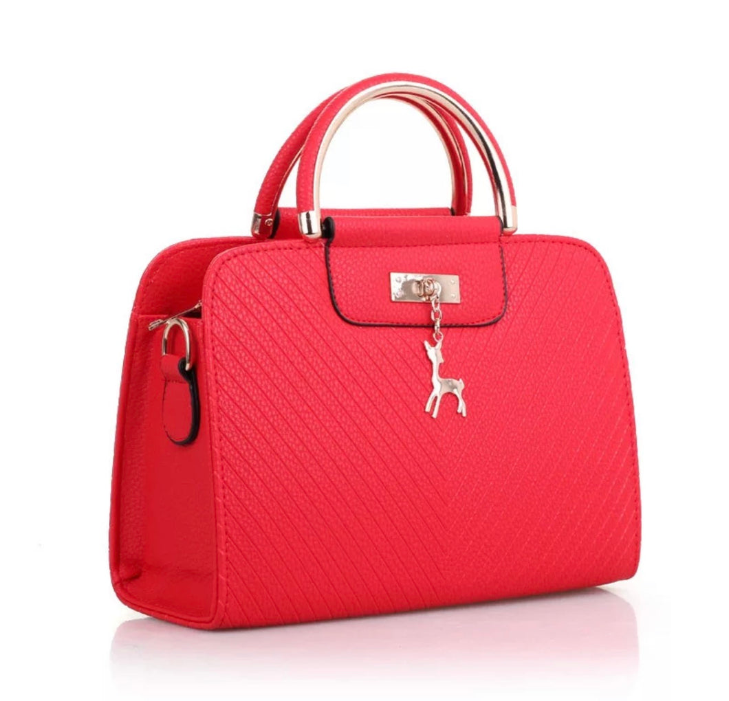 PURSE WITH ANIMAL BUCKLE DESIGN